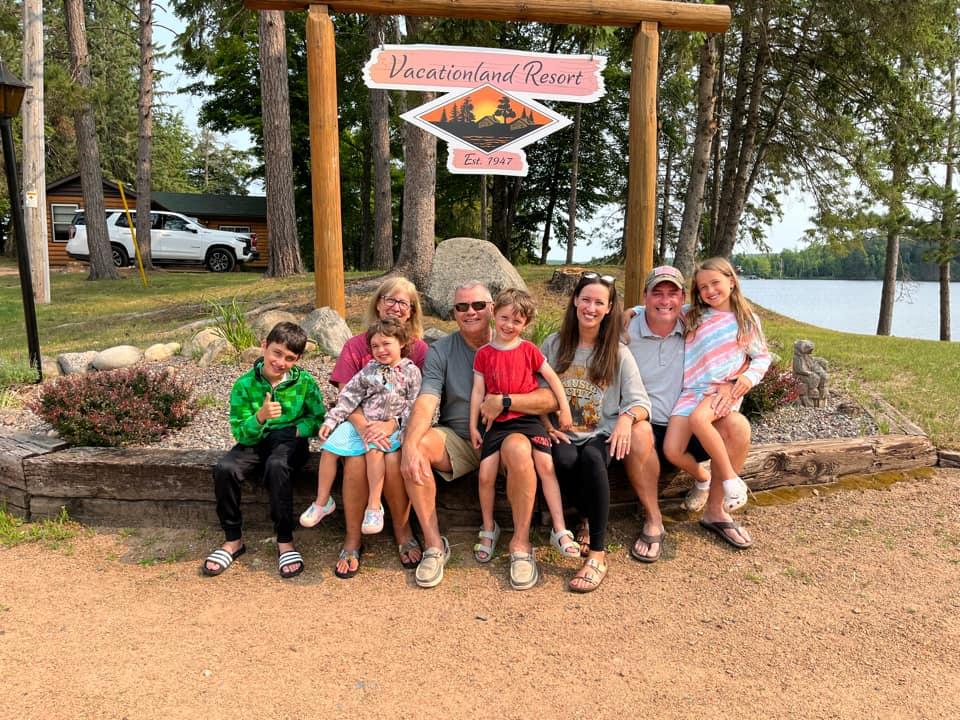 multi-generational family posing for photo at the resort