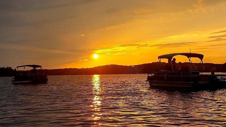 pontoons on the lake at sunset